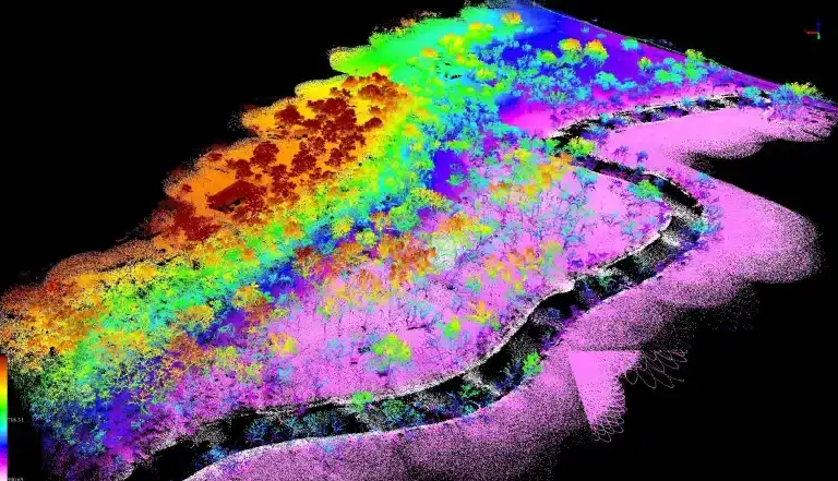A detailed, high-density 3D LiDAR point cloud showing intricate ground features and structures.